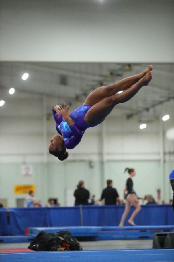 Taysia Smiley performing a gymnastics floor routine
